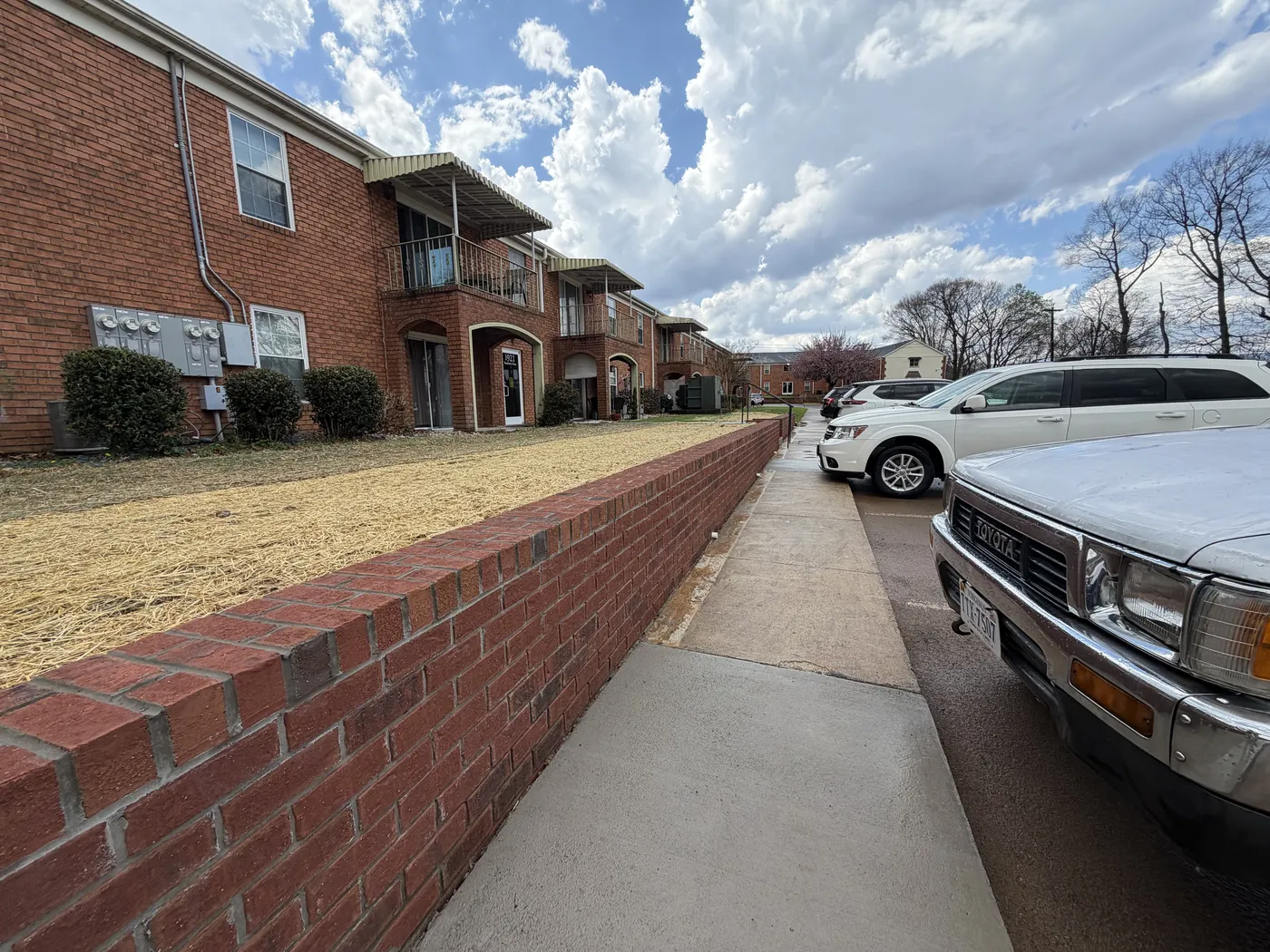 Retaining wall perspective showing full length along parking lot